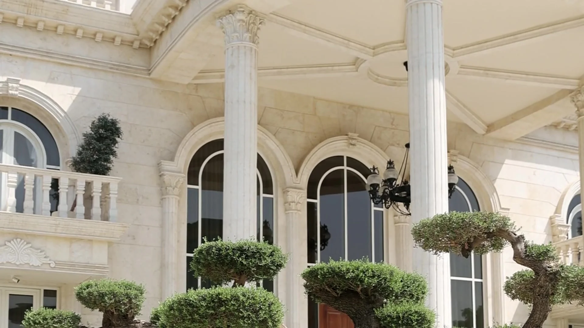 A Maple & Lane residence with classical architecture and landscaped gardens